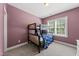 bedroom featuring a cozy bunk bed with a bright color scheme and natural lighting at 1123 Ambrose Dr, Rolesville, NC 27571