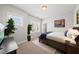Bright bedroom with stylish decor, TV, and two windows for natural light at 1123 Ambrose Dr, Rolesville, NC 27571
