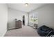 Bedroom with neutral walls, carpet and large window at 1123 Ambrose Dr, Rolesville, NC 27571