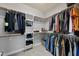 Walk-in closet with built-in shelving and hanging racks providing ample storage at 1123 Ambrose Dr, Rolesville, NC 27571