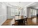 Eat in area with dark wood table and seating featuring natural light and trim detail at 1123 Ambrose Dr, Rolesville, NC 27571