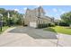 Spacious driveway leading to a two-car garage, with basketball hoop and well-maintained landscaping at 1123 Ambrose Dr, Rolesville, NC 27571