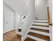 Bright stairway and entryway with hardwood floors and wainscoting at 1123 Ambrose Dr, Rolesville, NC 27571