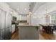 Bright kitchen with granite counters, stainless appliances, and center island open to eat-in area at 1123 Ambrose Dr, Rolesville, NC 27571