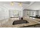 Kitchen island featuring a granite countertop and stainless steel sink with view to eat in area at 1123 Ambrose Dr, Rolesville, NC 27571