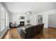 Spacious living room featuring a fireplace, hardwood floors, and open access to staircase at 1123 Ambrose Dr, Rolesville, NC 27571