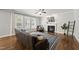 Cozy living room featuring a fireplace, hardwood floors, and an abundance of natural light at 1123 Ambrose Dr, Rolesville, NC 27571
