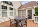 Cozy back patio featuring an outdoor table and chairs on a wood deck at 11571 Auldbury Way, Raleigh, NC 27617