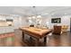 Finished basement with a pool table and ample space for recreation and entertainment at 11571 Auldbury Way, Raleigh, NC 27617