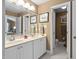 Bright bathroom with double sink vanity, ample storage, and view of the bedroom at 11571 Auldbury Way, Raleigh, NC 27617