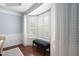 Cozy bay window nook with plantation shutters, bench seating, and hardwood floors at 11571 Auldbury Way, Raleigh, NC 27617