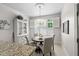 Cozy breakfast nook with plantation shutters and a stylish light fixture at 11571 Auldbury Way, Raleigh, NC 27617