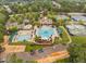 Aerial view of the community pool, clubhouse, and tennis courts amid lush landscaping at 11571 Auldbury Way, Raleigh, NC 27617