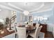 Charming dining room with a chandelier, wood table, and staircase in view at 11571 Auldbury Way, Raleigh, NC 27617