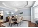 Elegant dining room with hardwood floors, wainscoting, and a crystal chandelier at 11571 Auldbury Way, Raleigh, NC 27617