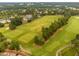 Aerial view of a well-maintained golf course with lush green fairways and tree-lined boundaries at 11571 Auldbury Way, Raleigh, NC 27617