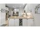 Spacious kitchen features stainless appliances, wine rack, and granite countertops at 11571 Auldbury Way, Raleigh, NC 27617