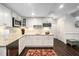 Kitchen area with stainless steel appliances, granite countertops and wine rack at 11571 Auldbury Way, Raleigh, NC 27617