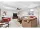 Comfortable living room with neutral tones and skylight offers a relaxing space for Gathering and guests at 11571 Auldbury Way, Raleigh, NC 27617