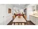 Open floor plan shows kitchen, dining area and living room with hardwood floors at 11571 Auldbury Way, Raleigh, NC 27617