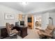 Office space featuring wood desk and chair, with a view to the kitchen at 11571 Auldbury Way, Raleigh, NC 27617