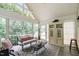 Bright sunroom with plenty of windows and a neutral color palette provides lots of sunlight at 11571 Auldbury Way, Raleigh, NC 27617