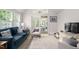 Cozy sunroom with comfortable seating, lots of light, and access to the outdoors at 11571 Auldbury Way, Raleigh, NC 27617