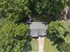 Bird's-eye view of a home with a well-maintained roof and tree-lined surroundings at 116 Hidden Cellars Dr, Holly Springs, NC 27540