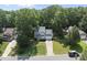 Well-manicured home exterior featuring lush landscaping and a welcoming entrance at 116 Hidden Cellars Dr, Holly Springs, NC 27540