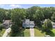 Charming two-story home with classic architecture nestled among mature trees at 116 Hidden Cellars Dr, Holly Springs, NC 27540