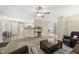 Open-concept living room with carpeted floors, a ceiling fan, and access to other rooms at 116 Hidden Cellars Dr, Holly Springs, NC 27540