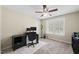 Comfortable home office featuring a desk, chair, and natural light from a large window at 116 Hidden Cellars Dr, Holly Springs, NC 27540