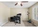 Comfortable home office featuring a desk, chair, and natural light from a large window at 116 Hidden Cellars Dr, Holly Springs, NC 27540