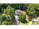 An aerial view of a house showing its location among tall green trees at 149 Hadley Ln, Clayton, NC 27527