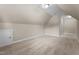 Bright, carpeted attic space with neutral walls, dormers, and ample room for storage or custom finishing at 149 Hadley Ln, Clayton, NC 27527