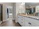Bright bathroom features a granite countertop, white cabinets, and a separate shower at 149 Hadley Ln, Clayton, NC 27527