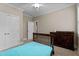 Bedroom featuring neutral walls, plush carpet, a ceiling fan, and a dark wood dresser at 149 Hadley Ln, Clayton, NC 27527