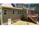 Back exterior view featuring deck with stairs and basement door at 149 Hadley Ln, Clayton, NC 27527