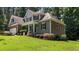 Lovely home with a covered porch, beautiful landscaping and well-maintained lawn at 149 Hadley Ln, Clayton, NC 27527