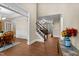 Open foyer with hardwood floors, staircase, and views into the dining room and living area at 149 Hadley Ln, Clayton, NC 27527