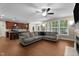 The open living room features a large sectional sofa, wood-look floors, and a view of the modern kitchen at 149 Hadley Ln, Clayton, NC 27527