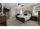 Spacious main bedroom featuring a fan, natural light, and neutral tones at 149 Hadley Ln, Clayton, NC 27527