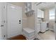 Mud room featuring an exterior door, bench with storage, and a laundry room at 149 Hadley Ln, Clayton, NC 27527