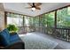 Relaxing screened porch featuring a comfortable sofa, area rug and views of a lush backyard at 149 Hadley Ln, Clayton, NC 27527
