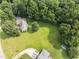 Stunning aerial view of the property showcasing the expansive yard and surrounding trees at 150 Williamston Ridge Dr, Youngsville, NC 27596