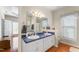 This primary bath boasts dual sinks, a tub, and a shower at 150 Williamston Ridge Dr, Youngsville, NC 27596
