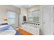 A luxurious bathroom with a soaking tub, a separate shower, and a double vanity at 150 Williamston Ridge Dr, Youngsville, NC 27596