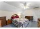 This bedroom features good light, carpet, and a ceiling fan at 150 Williamston Ridge Dr, Youngsville, NC 27596