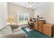 Bright office featuring a wooden desk, a patterned sofa, and natural light from the window at 150 Williamston Ridge Dr, Youngsville, NC 27596