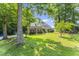 Charming brick home with a manicured lawn and mature trees at 150 Williamston Ridge Dr, Youngsville, NC 27596